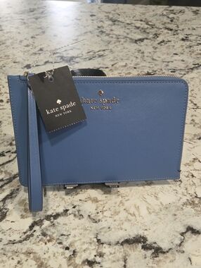 kate spade blue saffiano wristlet with gold logo